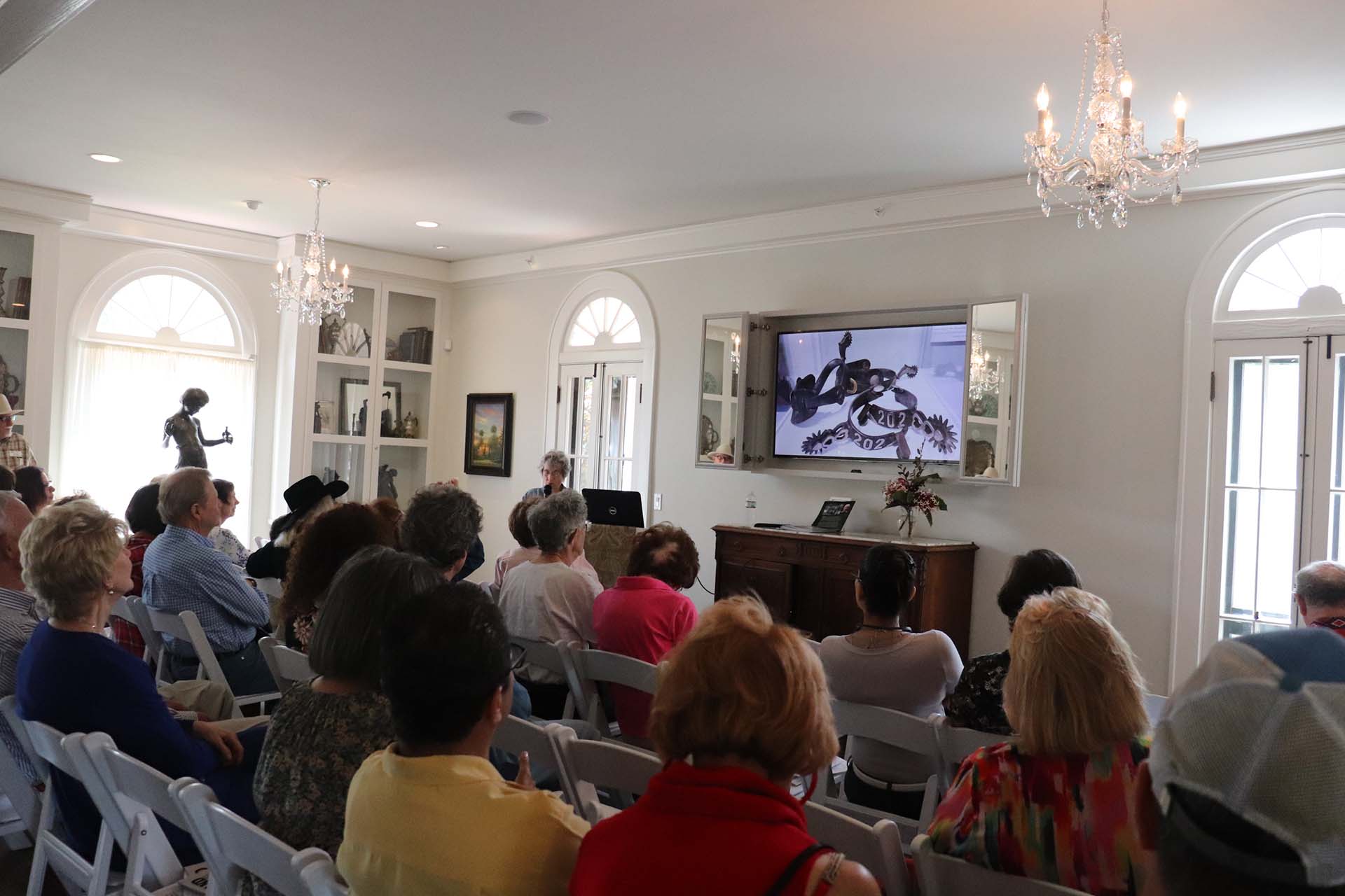 People at an indoor event at the Polasek Museum